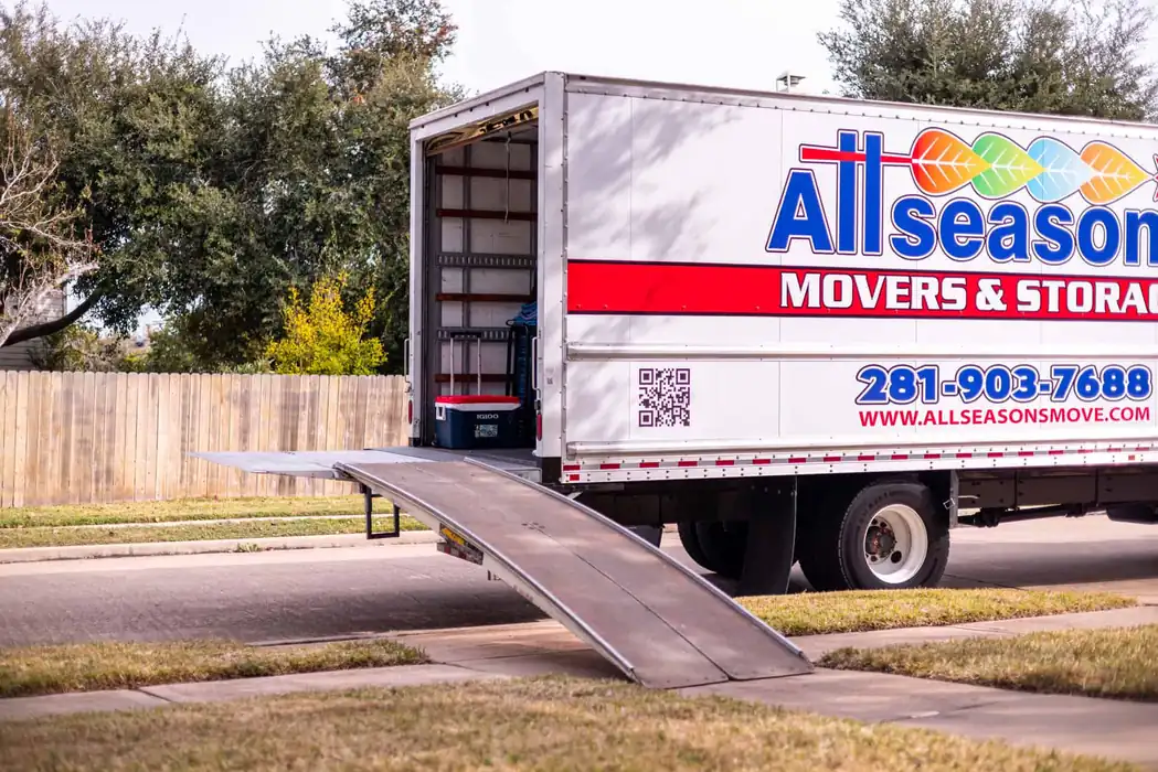 Moving truck with the ramp down at a Sugar Land, TX home