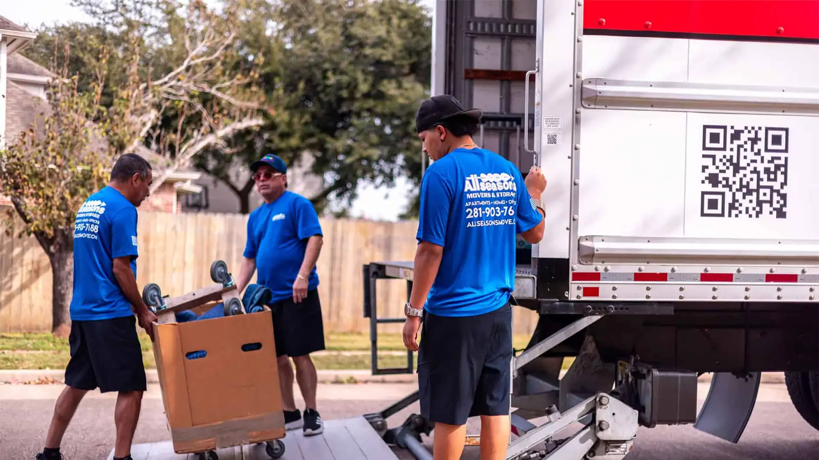 Movers loading boxes into a moving truck in Sugar Land, TX