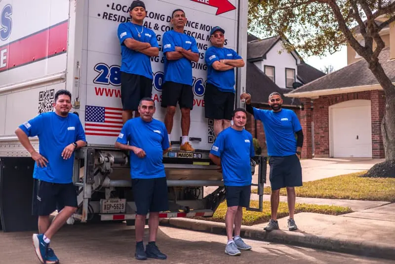 Sugar Land movers standing with the All Seasons moving truck